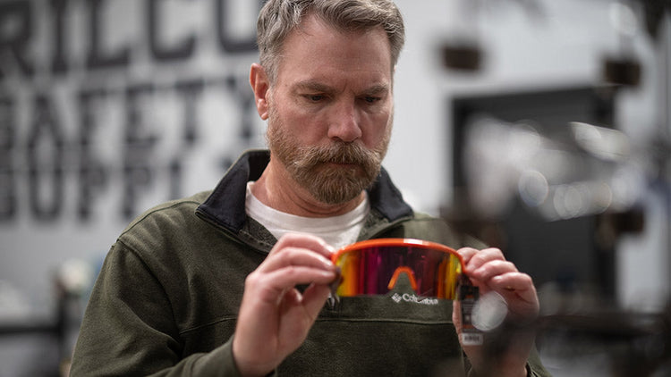 man looking at eye protection ppe